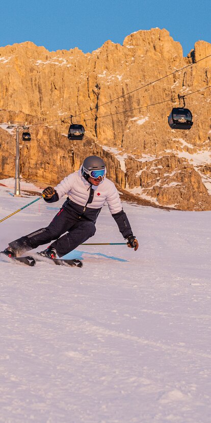 Downhill King Laurin Piste - Rosengarten in the evening glow | © Carezza Dolomites/Harald Wisthaler