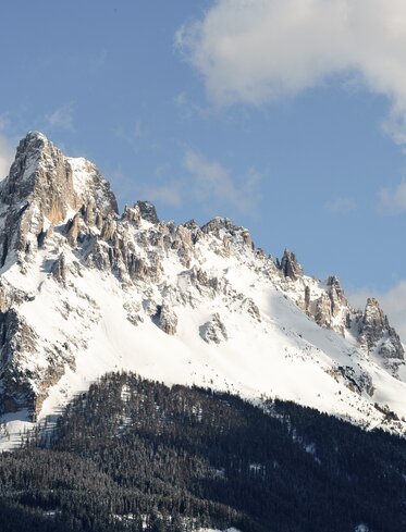 Snowy Eggentaler Horn in the mountain group of the Latemar | © Valentin Pardeller