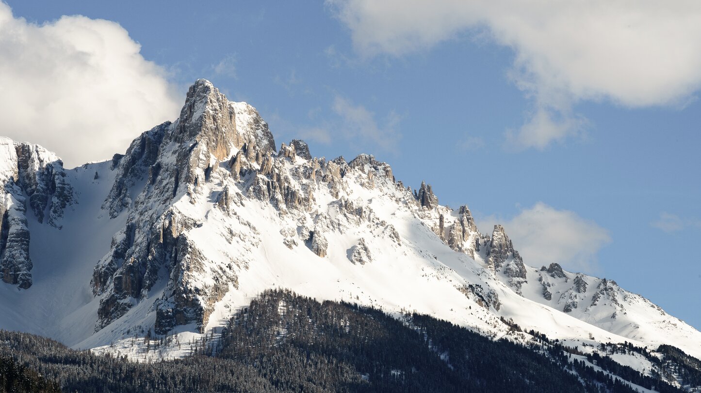 Snowy Eggentaler Horn in the mountain group of the Latemar | © Valentin Pardeller