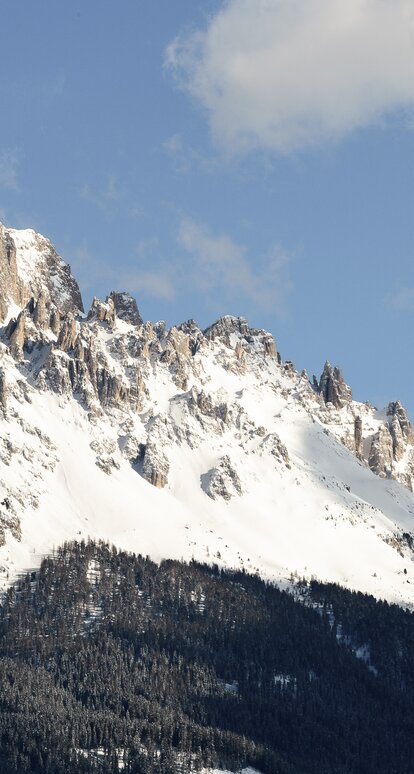 Snowy Eggentaler Horn in the mountain group of the Latemar | © Valentin Pardeller