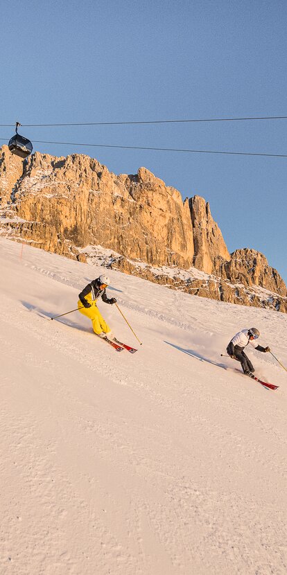 Due sciatori pista Coronelle Catinaccio Enrosadira | © Harald Wisthaler
